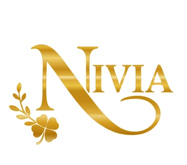 Elegant gold Nivia brand logo featuring a serif typeface with a metallic gradient and a four-leaf clover accent.