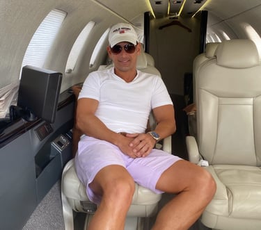 Rick Rockefeller-Silvia sitting in a private jet