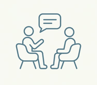 Line art icon of two people sitting in chairs having a conversation with a speech bubble.