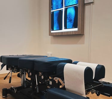 Chiropractic adjustment table at our Cheras clinic for spinal manipulation treatment