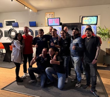 a group of people standing around a room