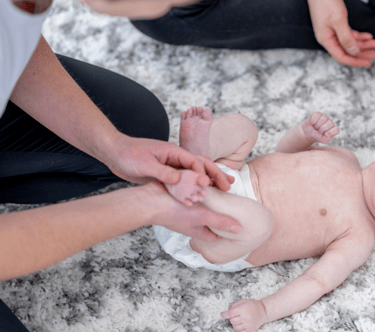 a baby receiving physiotherapy at early stage