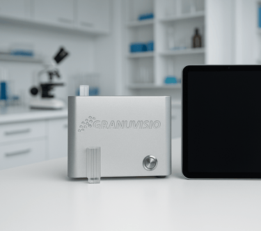 a granulometer sitting on a table with a tablet