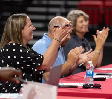 judges applaud students after a main stage presentation