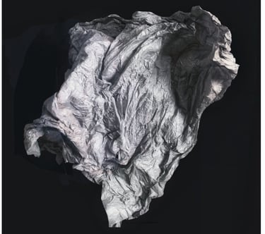 An abstarct photo of a sheet or membrane floating in a black space