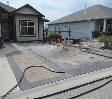 Pavers in place, area now square.
