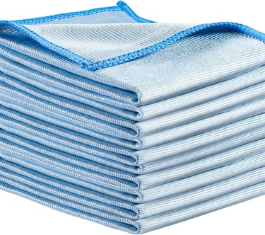 a stack of folded towels with a blue and white towel