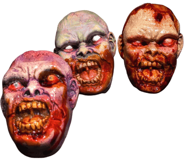 a group of three different colored zombie magnets 