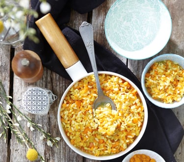 a bowl of food with a spoon and a spoon in it