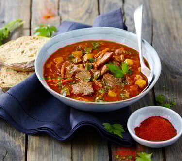 a bowl of soup with a spoon and a spoon in it