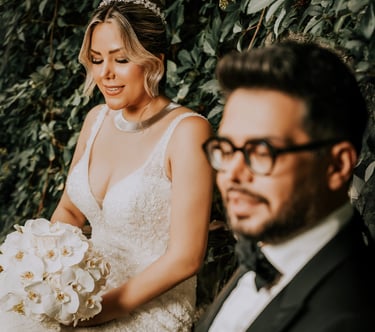 Wedding photography in London – bride and groom sitting with bouquet by Fred Art Studio.