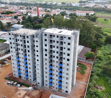 a tall building with a crane in the middle of it