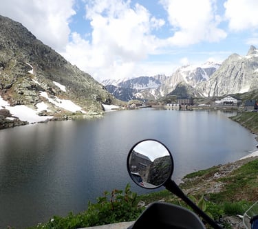 a motorbike parked in front of a mountain Mont Blanc