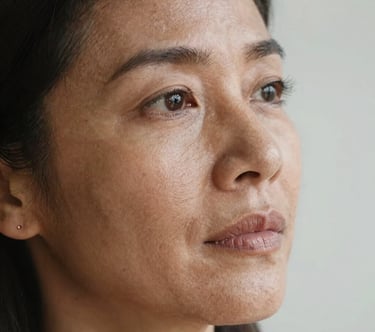 Close-up of a sleek, modern workspace with a laptop showing a creative website design.
