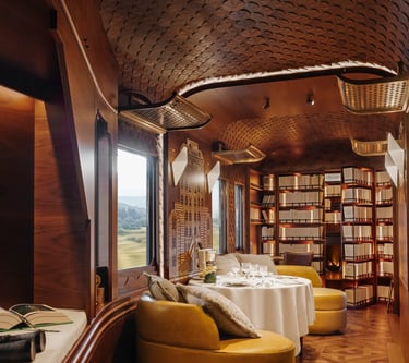 Britannic Explorer train L’Observatoire lounge with marquetry design and private dining area.