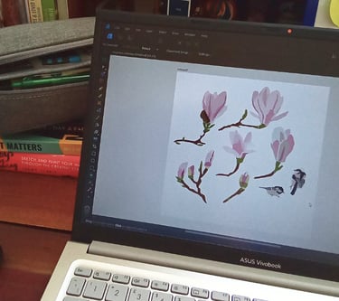 laptop showing floral art design in process