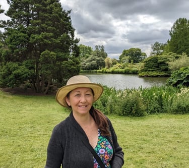 Artist standing by a lake in England