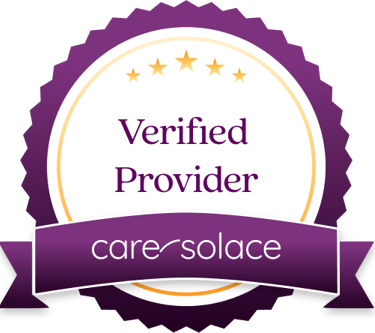 a purple badge with the words verified by care - solace