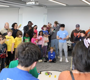 K-12 children at Robotics Day event by IEEE volunteers