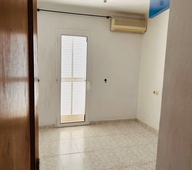 a room with a door and a window