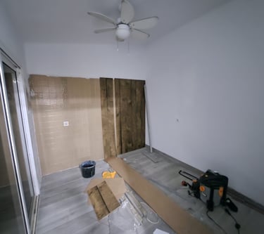 a room with a ceiling fan and a ceiling fan