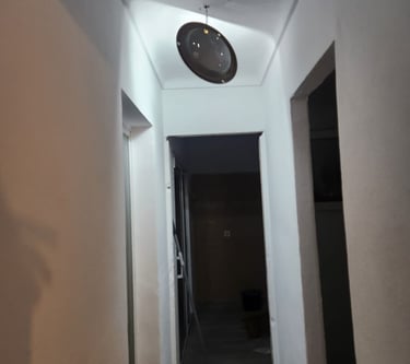 a clock on the wall of a hallway