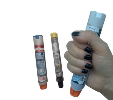 Close-up of several emergency training devices, adrenaline auto-injector for treating anaphylaxis