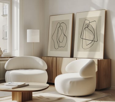 Minimalist abstract art with black lines on beige, two art prints displayed on a wooden cabinet