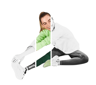 Smiling woman with a prosthetic leg stretching in athletic wear.