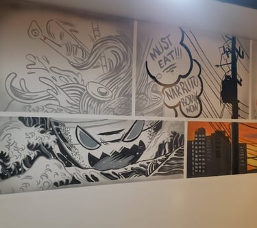 Anime style images on the wall of a restaurant.