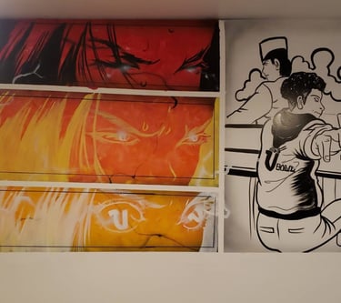 Anime images painted on the wall of a restaurant.