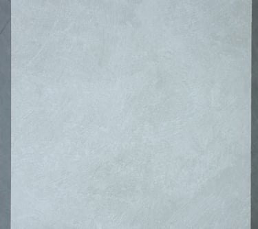 A soft stone slate with subtle white and gray patterns, perfect for minimalist commercial decor.