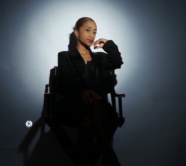 Ruby sitting in a chair with a cigarette in her hand