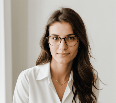 a woman in glasses and a white shirt