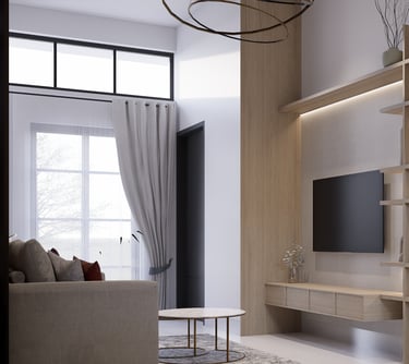 Interior ruang keluarga rumah Andara Maharupa Village luas dan terang