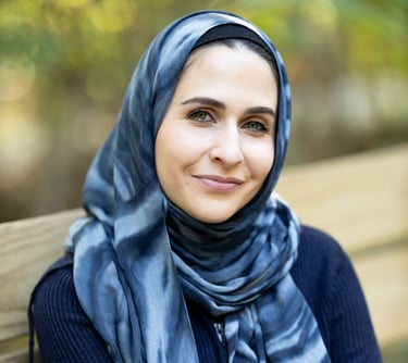 a mental health therapist in Indiana and Kentuckyin a blue scarf and scarf around her neck