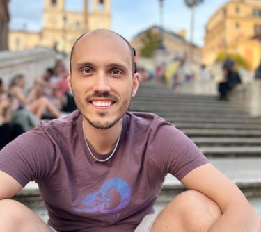 a man sitting on a staircase in front of a crowd of people