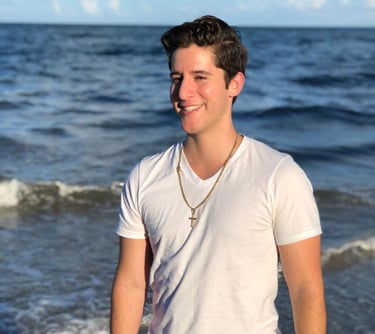 Rene Aviles in a white shirt and black pants