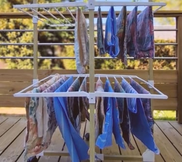 a clothes rack with clothes hanging on it