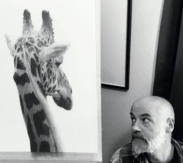 A photo of Will Arden with a drawing of a giraffe