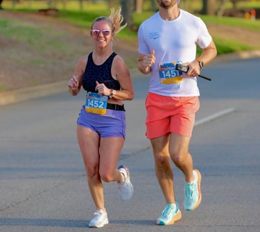 A photo of a beautiful couple running a fun Race Ready Events 5k together