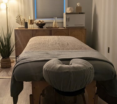 a massage table with a hot towel warmer