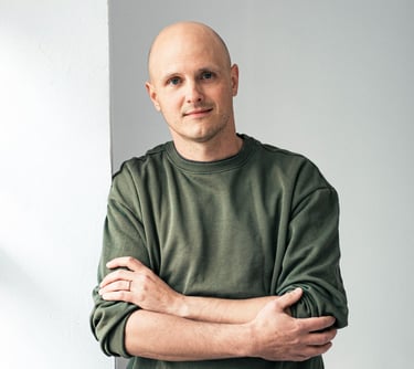CTO Daniel Bodner standing against wall