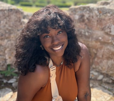 a woman in a tan top