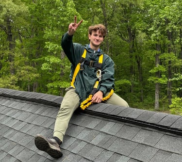 a man sitting on a roof top of a roof