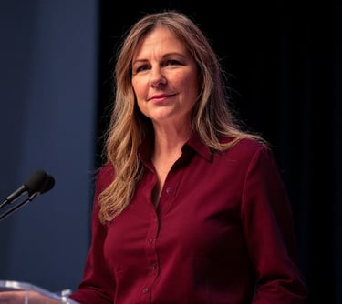 Vulcan Consultant standing at a podium on stage during a keynote on ethical persuaion