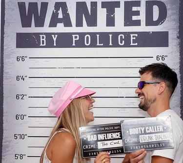 Friends posing with police mugshot boards Selfie Experience Split interactive museum.