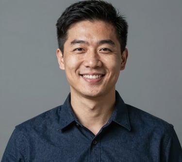 A smiling man looks confident and content