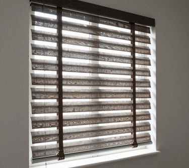 Close-up of elegant roller shades softly filtering sunlight in a modern living room.
