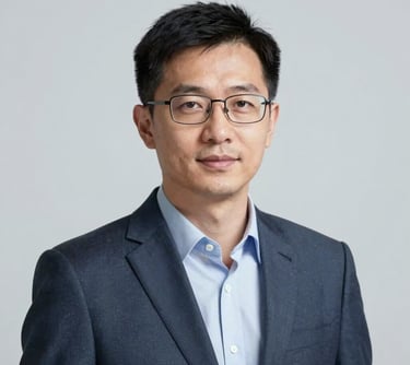 A professional portrait of a man with glasses, looking approachable and knowledgeable. Clean studio lighting with a neutral palette featuring #3C5A6C accents. He represents an expert in academic content.